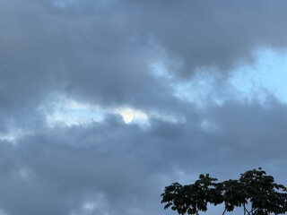 Moon creeping out of storm clouds 
