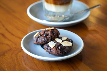 Chocolate almond cookies, captured on May 14, 2025. Crispy and rich cocoa cookies with chunks of...