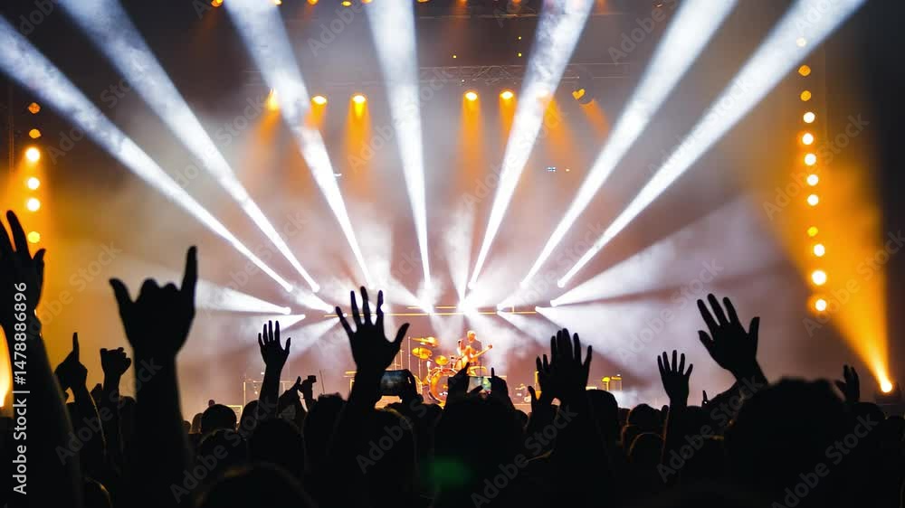Poster delighted audience enjoying an electrifying live performance under dazzling stage lights, a delighte