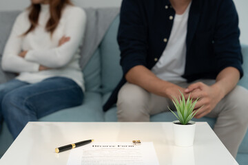 Divorce. Wife remove married ring and sign Divorce form. Couples desperate and disappointed after...