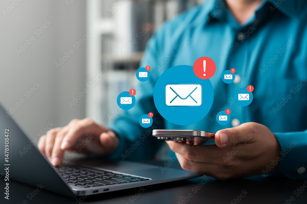 Poster businessman receiving multiple email notifications on smartphone while working on laptop, concept of