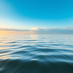 Obraz premium Calm sea with soft waves and golden morning sunlight glow