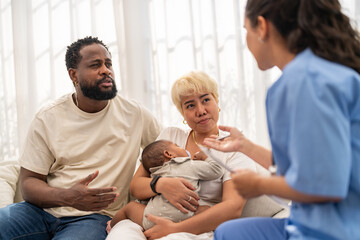 African baby health checkup with doctor pediatrician explaining results to parents, asian mother...