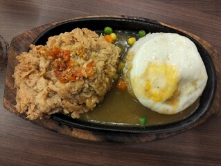 Fried chicken sticks with fried egg 