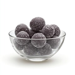 Dark purple, sugared, round candies in a small glass bowl