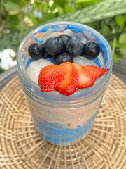Blue berry and strawberry mixed blue spirulina pea butter with yogurt over night oats meals