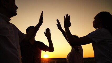 Business people. People united by common idea. Group people raise hands sky, join palms together...