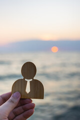Model of company employees with the sun rising in the morning. Concept of employee appreciation and...