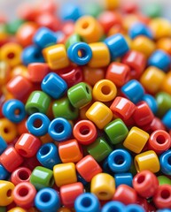 Close-up of colorful plastic pony beads in vivid red, yellow, green, blue, and orange tones, ideal for crafting, DIY jewelry projects, or playful creative design concepts

