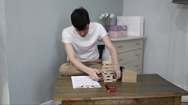 young adult man playing board games