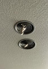 Obraz premium Ceiling Vents and Dust Bunnies: A Close-Up Study