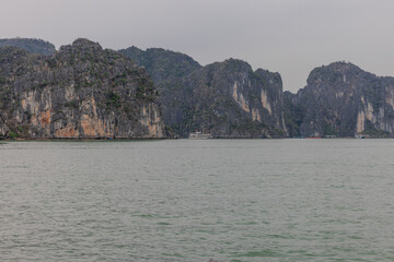 Halong Ha Long Bay Hanoi this Vietnamese wonder is littered with mountains and Rock cliffs popping out of the ocean, lush green mountains in Vietnam