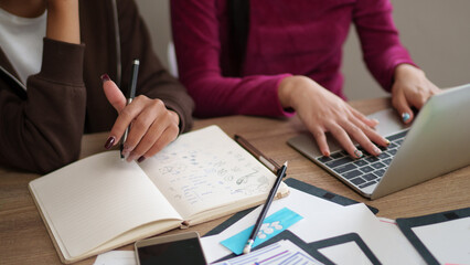 User Interface Designer Adult Asian Women Collaborate on Project Notebook Laptop Design Concept...