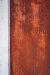 Old white and orange-brown painted concrete walls