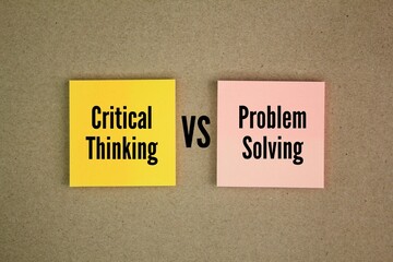 colored paper with the words critical thinking vs problem solving. identify the problem you're...