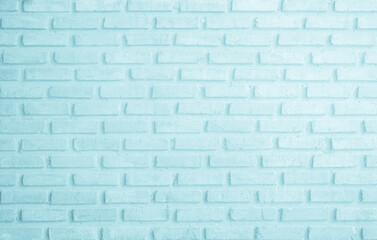 Fototapeta premium Brick wall painted with pale blue paint pastel calm tone texture background. Brickwork and stonework flooring interior rock old pattern clean concrete grid uneven bricks design stack backdrop.