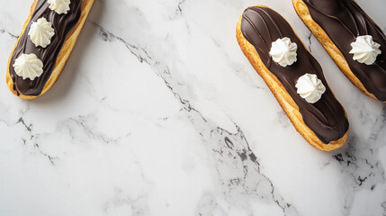 set of chocolate eclairs on a marble countertop