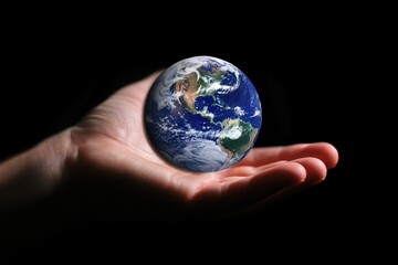 Holding the earth in hand represents the need for preservation and care for our planet, A hand holding a globe, signifying the preservation and upkeep of the natural world