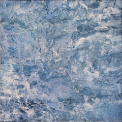 Close up of blue graphic background in random clouds and grunge pattern. Decorative washed textured blue paint. Suitable for wallpaper or tiles. Seamless background texture.