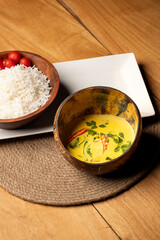 Sri Lankan coconut vegetable curry served with steamed rice, placed on a table mat over a dining table — capturing a vibrant and comforting South Asian meal presentation.