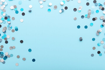 blue and silver confetti on a blue background