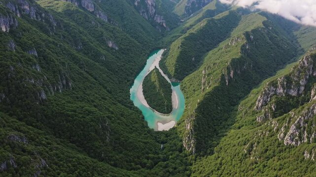 Breathtaking aerial view of the vrbas river canyon's striking emerald green waters winding through a vibrant valley
