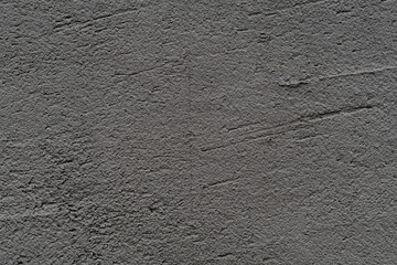 The texture of a gray concrete wall