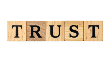 Wooden letter tiles spell out the word "TRUST" in bold black letters.