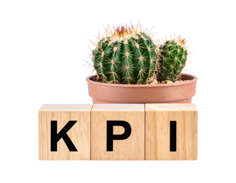 A small potted cactus sits behind wooden blocks displaying the letters KPI.