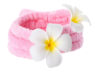 Soft pink headband adorned with two white and yellow frangipani flowers.