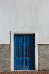 Blue Double Door on White Wall