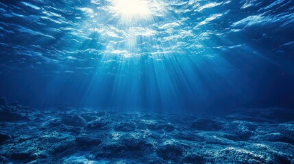 Sunlight rays penetrating the deep blue ocean