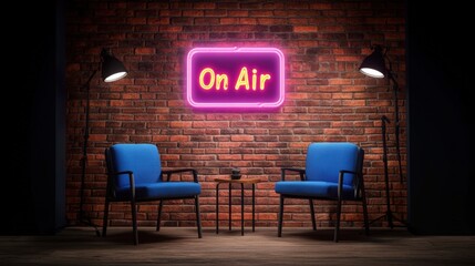 Cozy radio or podcast studio with two blue chairs and a small table in front of a brick wall illuminated by a neon "On Air" sign for broadcasting or recording sessions