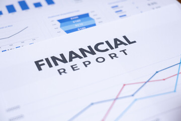 A document titled "Financial Report" with graphs and charts showing business data and analysis.