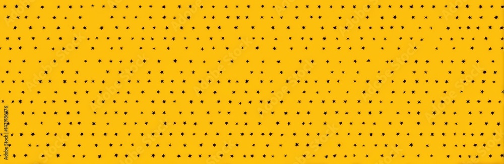 Poster repeating pattern of small dark marks on a yellow background.