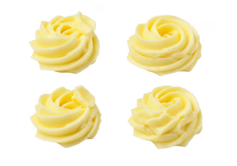 Four yellow frosting swirls isolated on transparent background