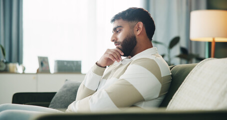 Serious, thinking and man in living room with vision, planning or remember memory. Decision,...