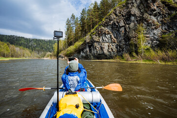 Embarking on an unforgettable journey through breathtaking scenic rivers, a kayaker experiences...