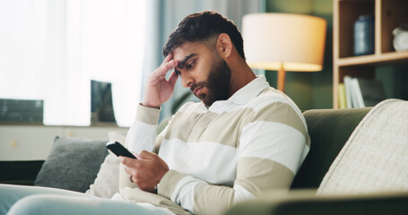 Home, man and sad with reading on smartphone, online message and breakup with contact on sofa....