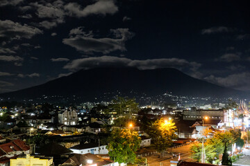Beautiful city view of Bukittinggi at night with Marapi Mountain in the background