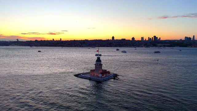 Ultra hd Stunning Sunset Over Istanbul's Maiden's Tower. Aerial video 4k of the KIZ KULESI (Leander's Tower) in istanbul, Turkiye, at sunset. Turkey tourism symbol beautiful shooting around the tower