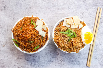 noodles in a bowl with two variants on the table