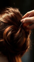 Obraz premium Elegant Updo Creation with Brown Hair and Hair Pin in Focus