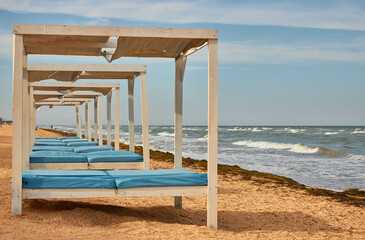 Fototapeta premium Beach Cabanas on Sandy Shore