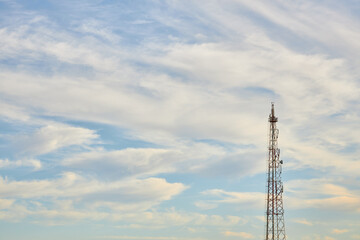 Cell Tower Against Cloudy Sky