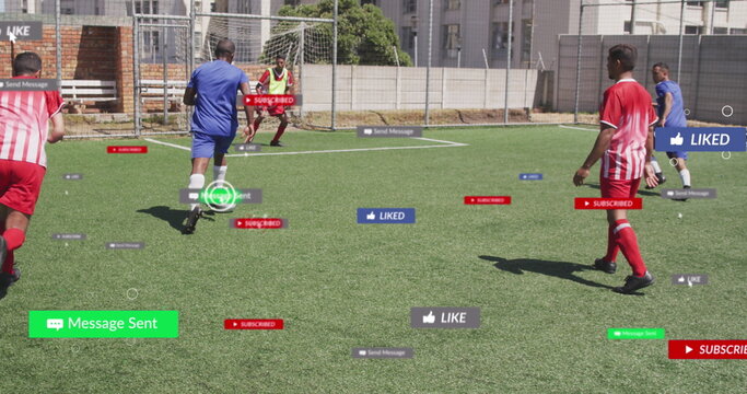 Social media concept icons over team of diverse male soccer players playing soccer on sports field - Powered by Adobe