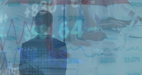 Image of financial data and graphs over back view of businesswoman with umbrella
