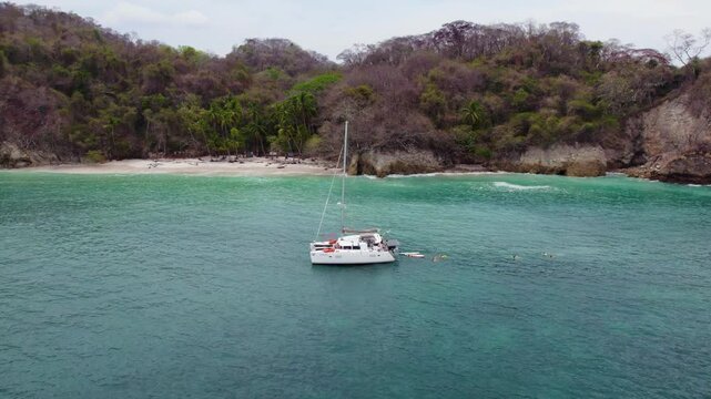 Summer holiday swimming and sailing in tropical waters of Curu Bay, Costa Rica