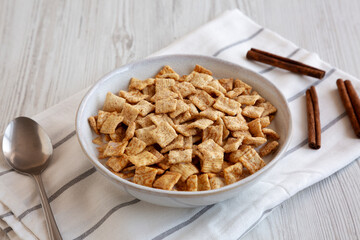 Crunchy Cinnamon Sugar Breakfast Cereal with Milk in a Bowl, side view.