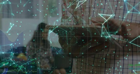 Colleagues analyzing business data in meeting, displaying holographic globe with glowing nodes - Powered by Adobe
